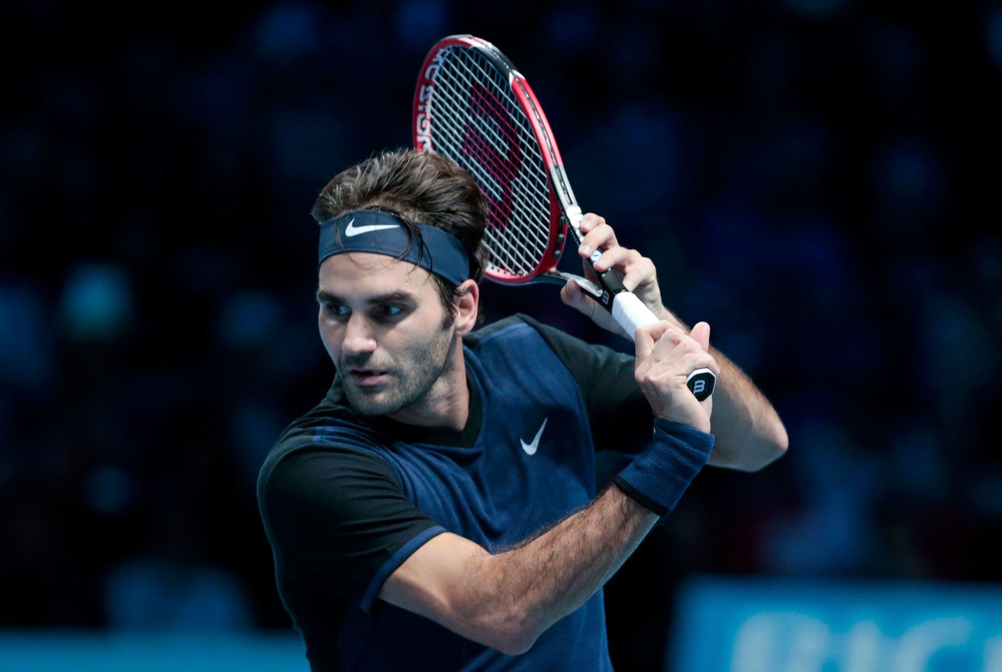this image pictures Roger Federer with wide passionate eyes to track a tennis ball he is about to hit. His passion towards his work inspires us.